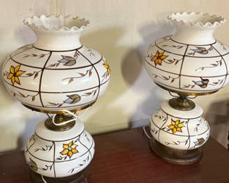 Here is a pair of beautiful opal glass hurricane lamps that have been hand painted with flowers!