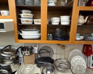 Lots of vintage corning, ware, and pots and pans