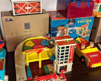 There’s the farm that when you open the door, it moo’s like a cow, and the great garage! You can also see the box for the village in the back and all the accessories in the red box above it