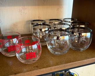 The two small rock glasses with the red design, are Rock Island roly-poly glasses! The eight beautiful mid-century, modern roly-poly glasses to the right or Dorothy Thorp style glasses. 