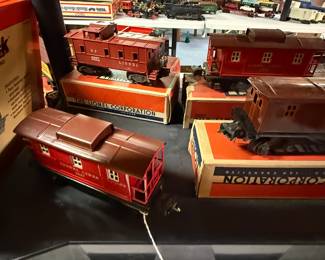 We have hundreds of train cars and accessories that are plastic, but I’m much prefer the tin metal ones from the World War II era!