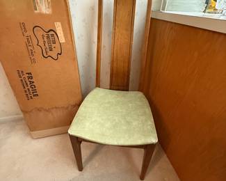 The bottom of the chairs is a green Naugahyde! The box to the left of this picture is the felt covers for the table