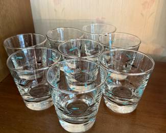 This is an outstanding set of mid-century modern vintage Mediterranean atomic fish tumblers by the Libby glass company! There is a full set of eight and they are pristine! These are absolutely getting harder and harder to find