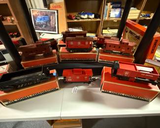 These are lovely pieces, mostly cabooses, but there is one engine there to the left