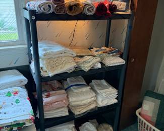 This rack is filled with sheet sets, all bundled together and ready to go