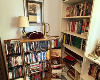 This corner of the room houses the rest of the books, DVD’s, some CD’s and a nice lamp! I LOVE the real bugle that is sitting on top of the DVD rack! 