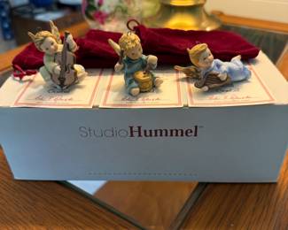 Here’s a great little trio of Hummels sitting on their original box. Each comes with the red velvet bag.!