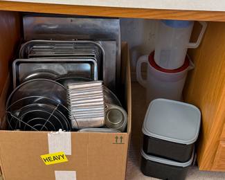 Pots and pans to the left Tupperware to the right