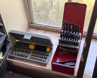 Multi-Bit Ratchet Driver Set - left, Metal Drill Bit Set - right