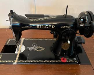 Vintage Singer sewing machine in cabinet