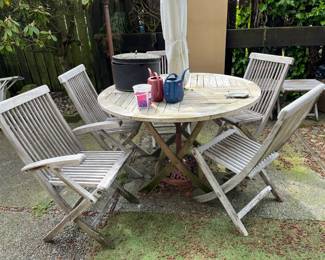 Sun bleached teak table, 4 folding chairs, umbrella