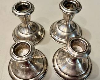 Sterling silver - Two pair weighted candleholders. Small ones in (2.5") front Frederick & Nelson's. Back row (3.5") marked Empire