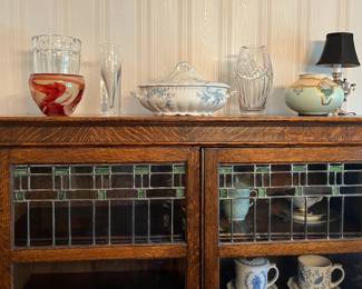 Close up of stain glass windows on oak bookcase