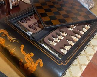 WHERE THE PIECES ARE KEPT HAS A PULL OUT DRAWER FOR EASY ACCESS