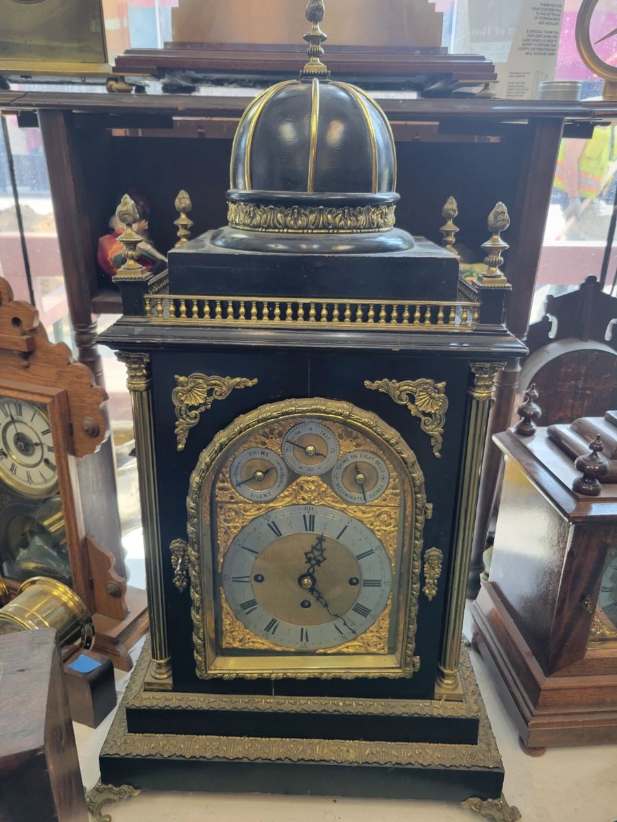 A large 33" Bell Bracket Clock. Triple Fusee, English Chiming. Nested Bell and Coiled Gongs. Westminster Chime. Serviced.