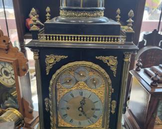 A large 33" Bell Bracket Clock. Triple Fusee, English Chiming. Nested Bell and Coiled Gongs. Westminster Chime. Serviced.