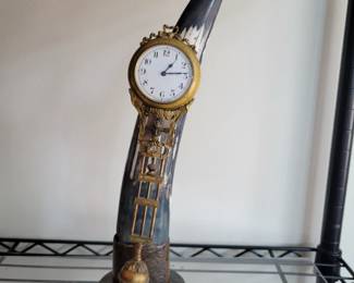 Mystery swinger clock on Black Horn. Serviced. 14" tall.
