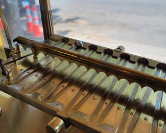 Congreve Rolling Ball Clock. Invented by Sir William Congreve in 1808. This reproduction was built in the 1960's by the worlds oldest Clockmaker, Thwaites & Reed of London. The tilting table and rolling ball act as the pendulum, with each oscillation taking 15 seconds. 