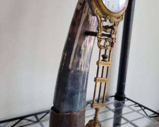 Mystery swinger clock on Black Horn. Serviced. 14" tall.