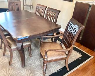 Bernhardt Furniture Dining table
45”w x 75” x 30”h with (2) leaves & pads $$850
4 carved wood, leather seat chairs $125ea
2 leather seat arm chairs $165 ea
Total set $1795