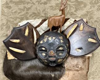 Lot of African Animal Pelts/Hides, Mounted Boar Tusks, Wooden Ceremonial Mask, Carved Gazelle