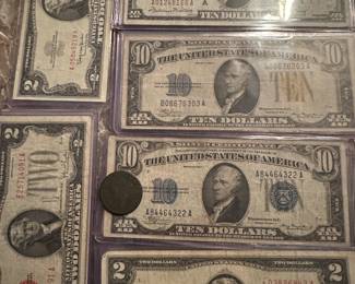 Nice lots of currency $10 bank notes, $10 north African notes , $2 star notes , large seals plus others