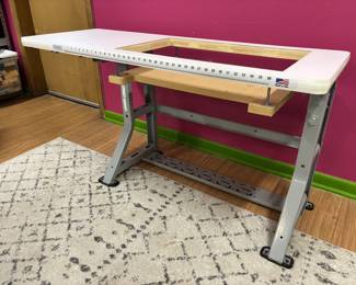 Sew Perfect Table for sewing machine. The table measures 20 inches by 56 inches. The opening measures 15 1/2 by 27.