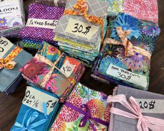 Lots of great fat quarter and half yard bundles. Tilda fabrics, Kaffe Facet fabrics, and many more great designer fabrics.