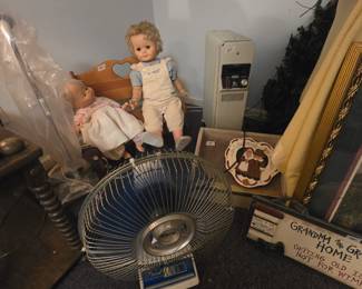 Fan & dolls in upstairs room over garage