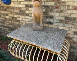 Iron and marble table and concrete dragon