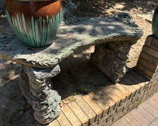 Heavy concrete bench with rabbits and animals