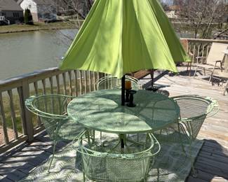 Vintage wrought iron patio set with color coordinated rug / umbrella