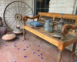 rustic bench, pottery, tin lanterns, wagon wheel