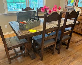 rustic western table with metal corner detail and six chairs