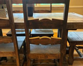 rustic western table with metal corner detail and six chairs