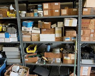 Lots of phone equipment; tools; boxes