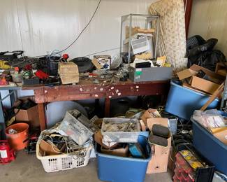 Lots of phone equipment; tools; boxes
