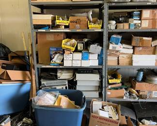 Lots of phone equipment; tools; boxes