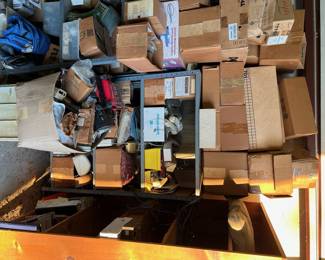 Lots of phone equipment; tools; boxes