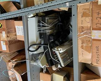 Lots of phone equipment; tools; boxes