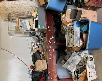 Lots of phone equipment; tools; boxes
