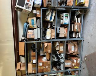 Lots of phone equipment; tools; boxes