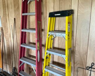 A 6 foot and 8 foot fiberglass ladders one is husky one is Wagner