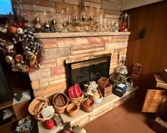 The fireplace is a display for baskets on the bottom and oil lamps on the top