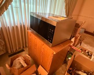Great pictures from the day we got the keys! Here is the second of TWO great microwaves on carts! Can’t wait to get into these boxes and see what great estate sale treasures they hold!