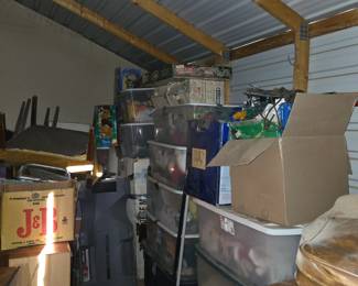 Storage Bins of Holiday Decorations. Also Christmas Trees