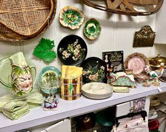 WALL OF MAJOLICA AND TOLE TRAYS.