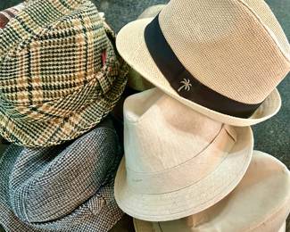 SO MANY MEN'S AND WOMEN'S HATS IN THIS HOUSE.