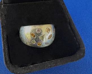 Platinum with brown,yellow and pink diamonds.