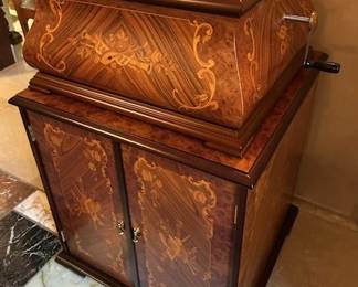 Antique Porter Music Box with several copper records.